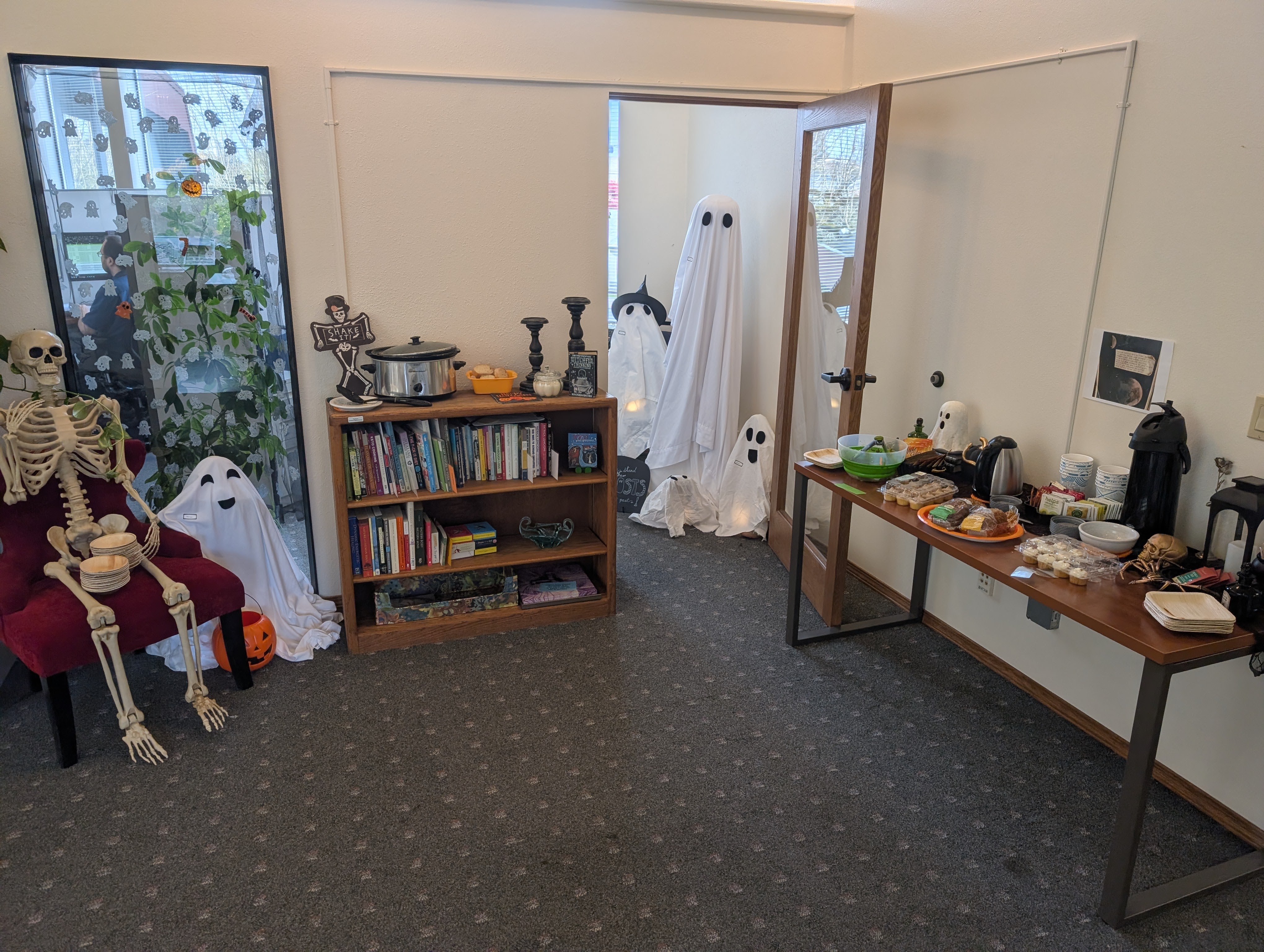 Office and Hallway decorated with ghosts and skeletons at the Northwest Regional Council's Halloween Office Crawl