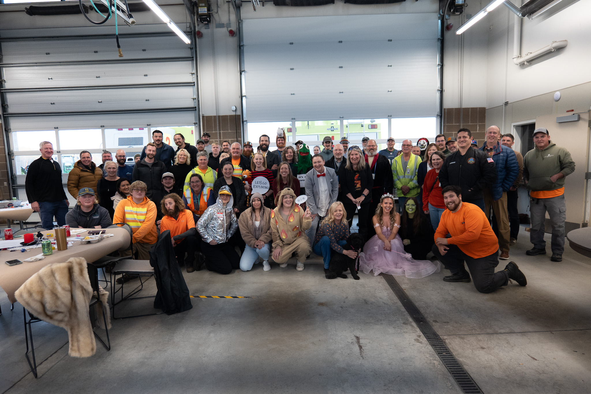A large group of Port of Bellingham employees poses in costumes at their Chili Cook-Off