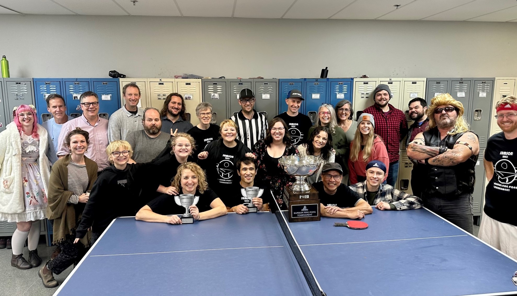 ground of Samson Rope employees posing for a picture after ping pong tournament